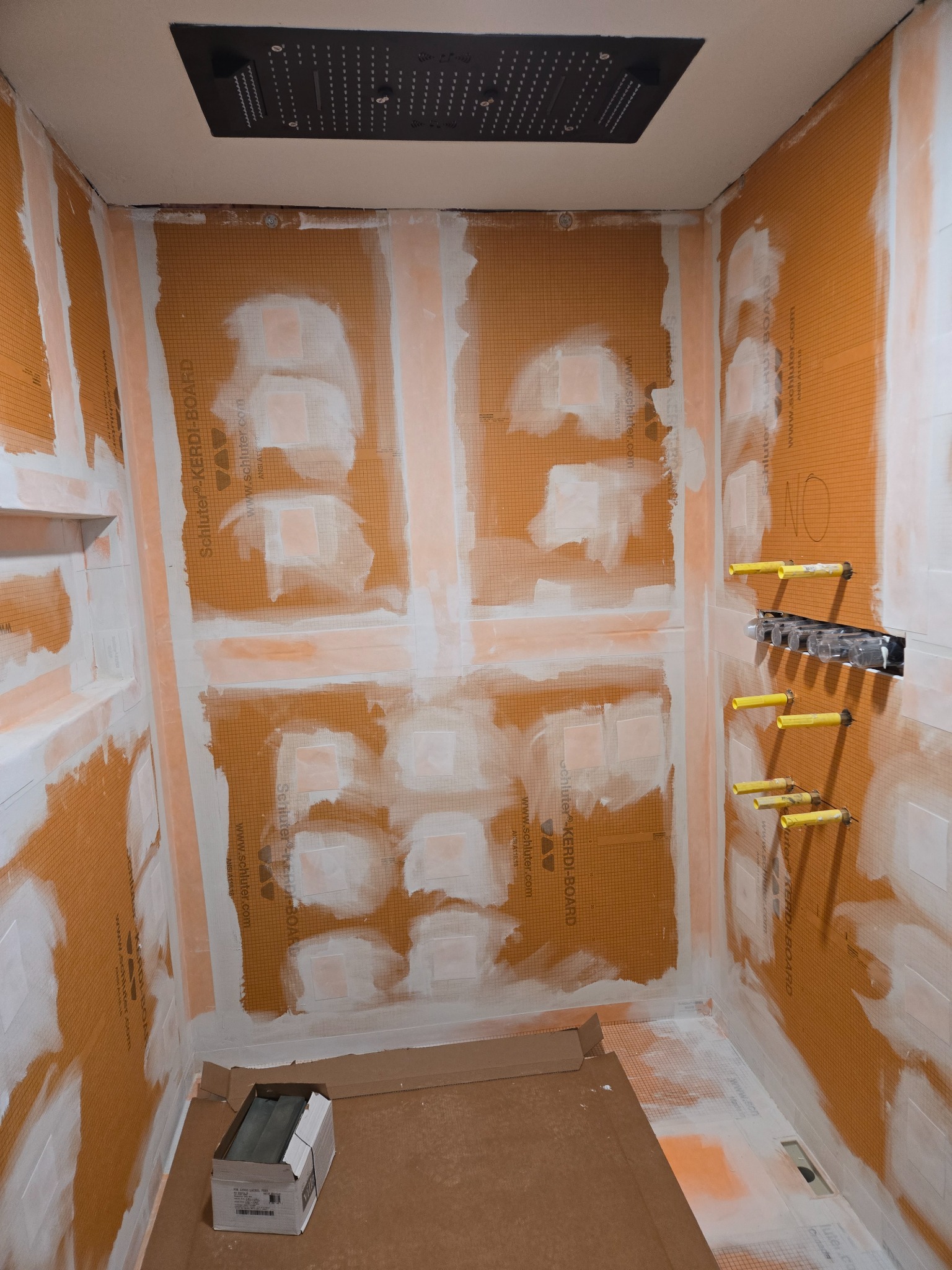 Schluter waterproofing preparation in a custom shower